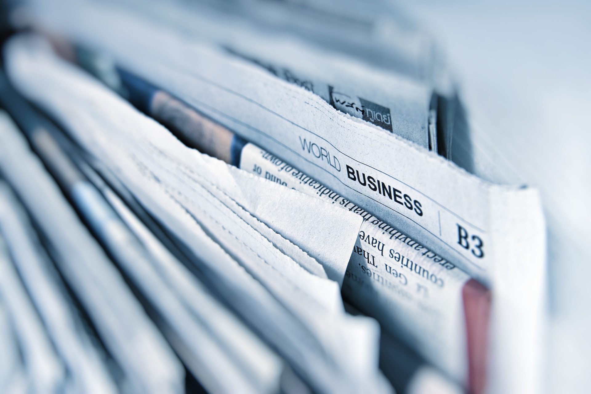 A stack of world business newspapers